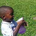 Child playing with squirt bottles