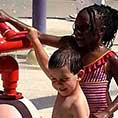 Child playing with water playset